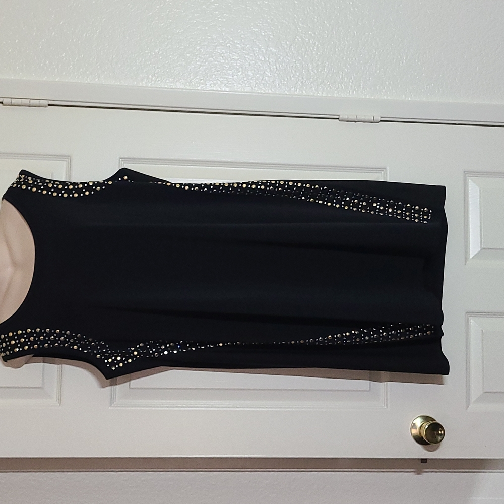 Cute black dress with stones snd studs on the side!